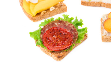 Sandwiches with ham and tomato.