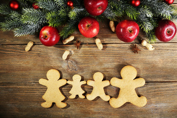 Christmas cookies and fruits on wooden table