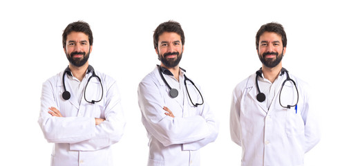 Fototapeta premium Doctor with his arms crossed over white background