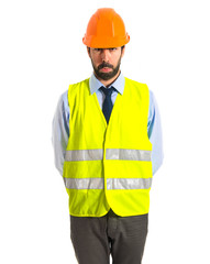 Sad worker over white background
