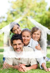 Composite image of happy family in the park