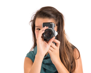 Girl photographing over white background