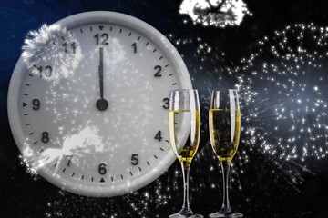 Fototapeta premium Composite image of clock at midnight