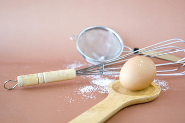 egg on wooden spoon