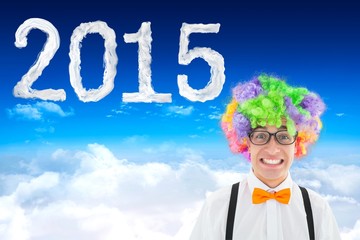 Composite image of geek in afro wig
