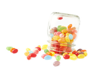 Jelly bean candies spilled out of jar