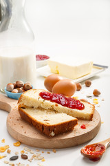 Healthy breakfast. Two slices of bread with jam on wooden table.