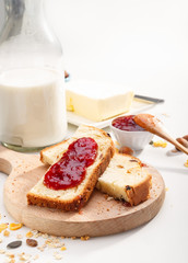 Healthy breakfast. Two slices of bread with jam on wooden table.