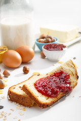 Healthy breakfast. Two slices of bread with jam on wooden table.