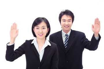 똑바로 서서 카메라를 응시하는 비즈니스 남성과 여성