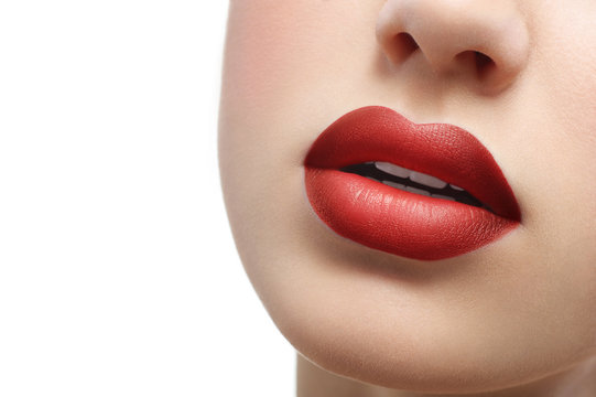 Red Lips Close Up On A White Background