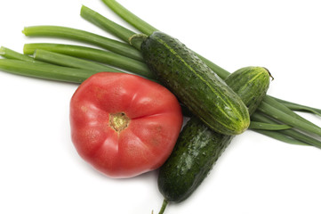 Salad - tomato, cucumber and green onions. Photo.