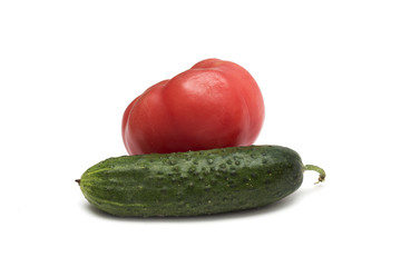 Red tomato and green cucumber. Photo.