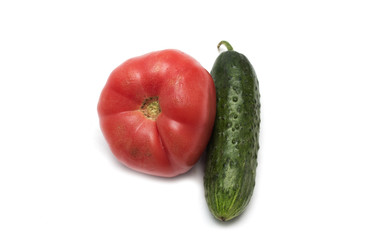 Red tomato and green cucumber. Photo.
