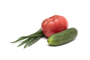 Salad - tomato, cucumber and green onions. Photo.