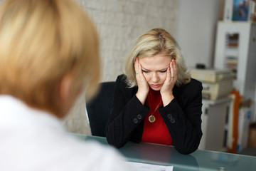 Depressed blonde employee dismissed in office