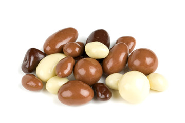chocolate covered nuts and raisins isolated on white