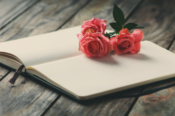 Elegant open book with pink roses