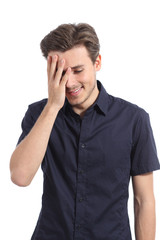 Naklejka premium Ashamed man smiling covering his face with a hand