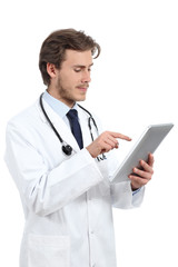 Serious doctor man browsing a tablet reader