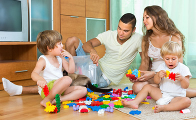 Obraz premium Happy family playing in home interior