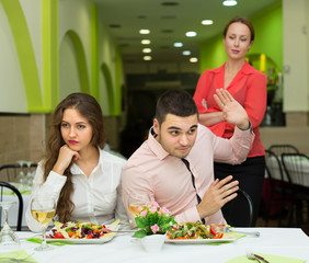 Unpleased couple in restaurant