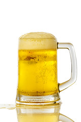 Frosty glass of light beer set isolated on a white background