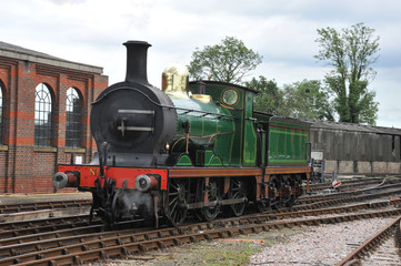 Plakat 20 th century steam engine at a station in Sussex.