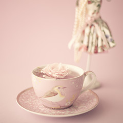 Vintage pink tea cup with a rose