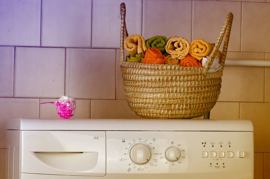 Washing machine with towels in basket
