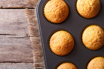 delicious muffins in baking dish top view horizontal