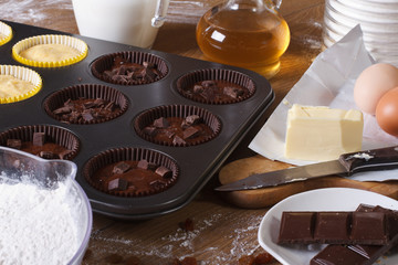 cooking chocolate and vanilla cupcakes close-up horizontal