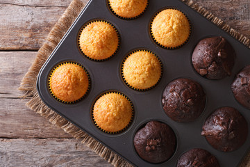 chocolate and vanilla muffins in baking dish top view