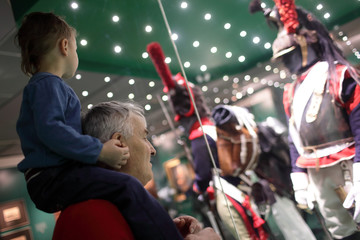 Grandfather with grandson in museum