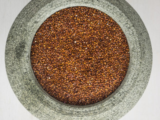 red quinoa in a stone bowl