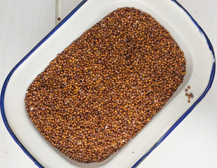red quinoa in an enamel dish