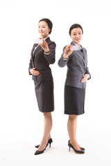 서서 제스처를 취하는 두 명의 아시안 은행원 