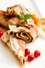 pancakes with chocolate and berries