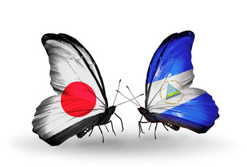 Two butterflies with flags Japan and Nicaragua