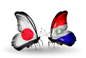 Two butterflies with flags Japan and Paraguay