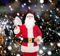 man in costume of santa claus with euro money