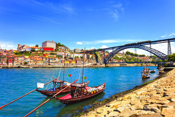 Oporto or Porto skyline, Douro river, boats and iron bridge. Por © stevanzz