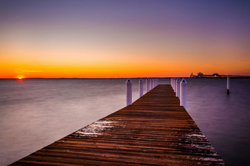 Fototapeta na wymiar A pier at sunset, Kent Island, Maryland.