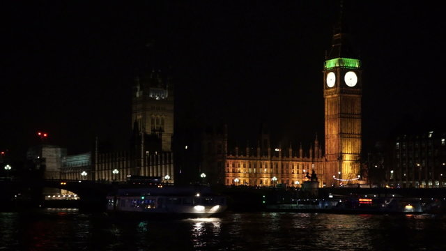Westminster bridge and Big Ben at night with boat