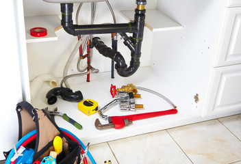 Plumbing tools on the kitchen.