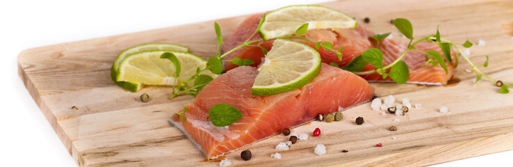 Fresh salmon fillet with oregano and lime slices