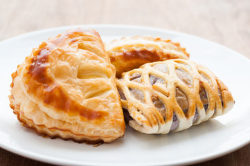 homemade fresh fruit pies on a tray