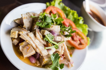 Spicy salad with pork.