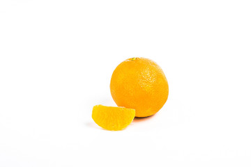 one mandarin and slice of tangerine