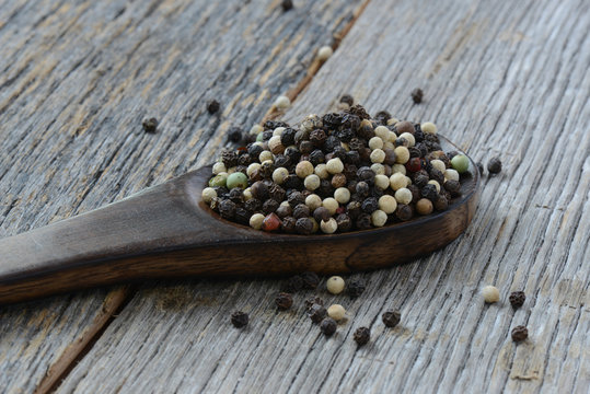 Peppercorn on a wooden Spoon